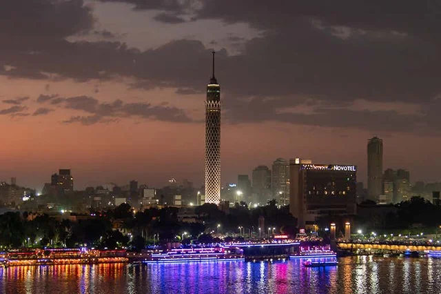 The lotus-shaped Cairo Tower in Zamalek, standing 187 meters tall against a blue Cairo sky.