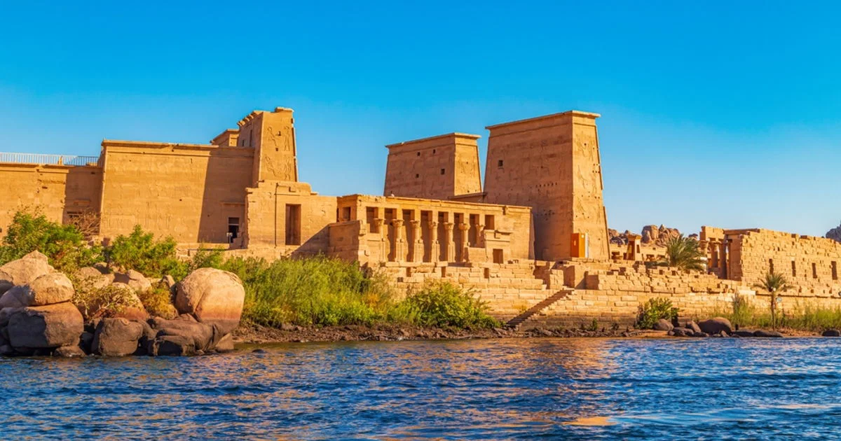 The majestic Philae Temple and Trajan's Kiosk reflecting beautifully in the Nile River 